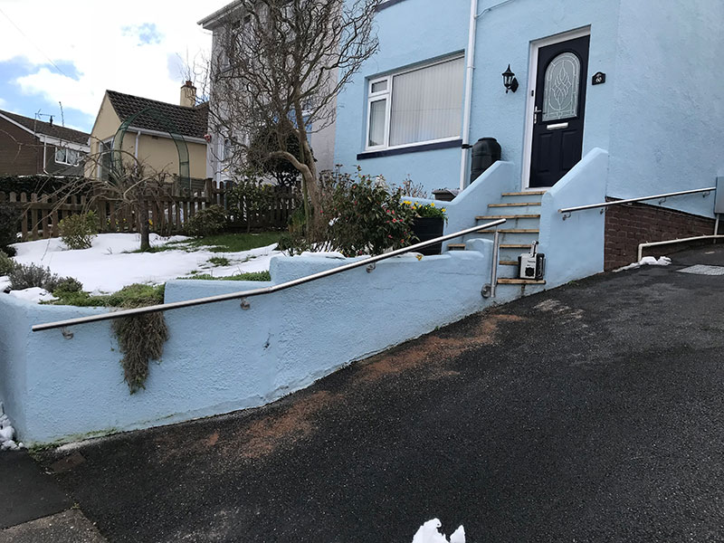 handrail on blue house